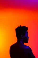 person in colourful studio