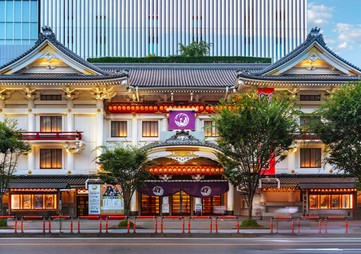 tokyo, ginza - july 25 2023: The white facade of the Kabukiza theater dedicated to the traditional kabuki drama form created in a Japanese architectural styles adorned with shining paper lanterns.