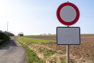 Round road sign with space for text in the farmland 