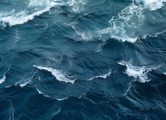 Fototapeta na wymiar Blue sea water with waves and foam as a background. High quality photo