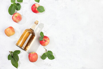 Apple cider drink, juice or fermented fruit drink and ingredients on a sunny table. Autumn banner. The concept of diet and weight loss. Healthy eating, body detoxification, 