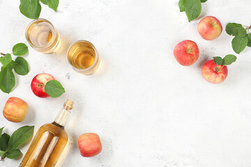 Apple cider, juice or fruit drink and ingredients on a sunny table.Autumn banner. The concept of diet and weight loss. Apples help cleanse the body and reduce weight. Healthy food, body detoxification