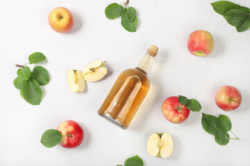 Apple cider drink, juice or fermented fruit drink and ingredients on a sunny table. Autumn banner. The concept of diet and weight loss. Healthy eating, body detoxification,