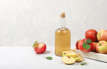 Apple cider drink, juice or fermented fruit drink and ingredients on a sunny table. Autumn banner. The concept of diet and weight loss. Healthy eating, body detoxification,