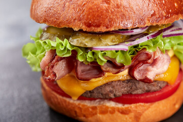 tasty burger with beef cutlet and vegetables