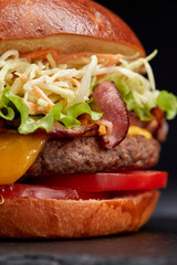 tasty burger with beef cutlet and vegetables