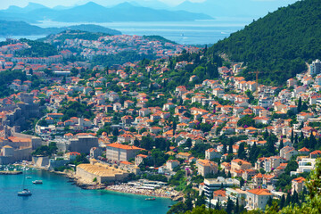 Fototapeta na wymiar aerial view of the fortress and old city on the seashore and mountains, panorama of the resorts of Dubrovnik in Croatia, Adriatic sea, beaches, islands, tourism and summer traveling