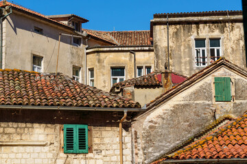 Fototapeta na wymiar street view of the old town of Kotor in Montenegro, medieval European architecture, city streets, red tiled roofs, the concept of traveling across the Balkans