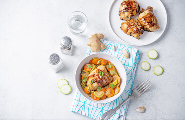 Moroccan spiced chicken with zucchini and carrots in a plate