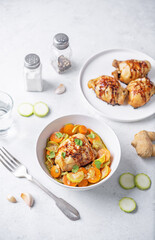 Moroccan spiced chicken with zucchini and carrots in a plate