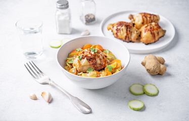 Moroccan spiced chicken with zucchini and carrots in a plate