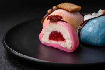 Delicious sweet colorful mochi desserts or ice cream with rice dough and toppings