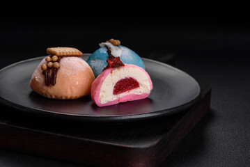 Delicious sweet colorful mochi desserts or ice cream with rice dough and toppings