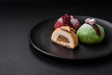 Delicious sweet colorful mochi desserts or ice cream with rice dough and toppings