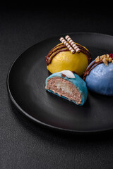 Delicious sweet colorful mochi desserts or ice cream with rice dough and toppings