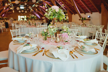 Wedding table with favors and flowers. Elegance wedding decor.