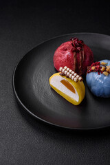 Delicious sweet colorful mochi desserts or ice cream with rice dough and toppings