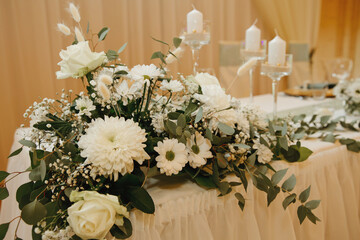 Beautiful tenderless bouquet on wedding table. Elegance wedding decor.