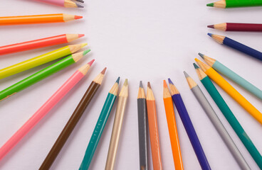 colored pencils in a circular design artwork 