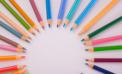 colored pencils in a circular design artwork 