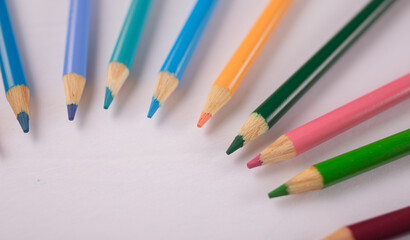 colored pencils in a circular design artwork 