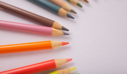 colored pencils in a circular design artwork 