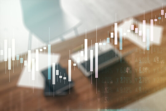 Abstract creative financial graph and modern desktop with computer on background, forex and investment concept. Multiexposure
