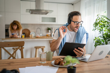 One man caucasian male freelancer work from home on laptop computer