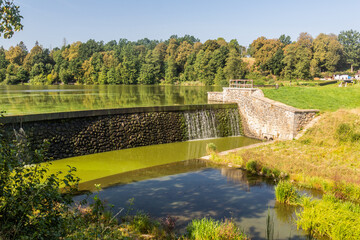 Fototapeta na wymiar Dam of Kambersky rybnik pond in Kamberk village, Czech Republic