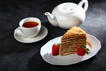 A slice of honey cake on a plate. Copy space. Selective focus.
