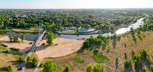 View at the bridge at Warta river in Sieradz city in Poland
 - obrazy, fototapety, plakaty