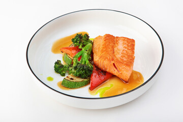 Grilled salmon fillet with vegetables. Healthy food. Grilled vegetables with fish.Copy space. Isolated object.