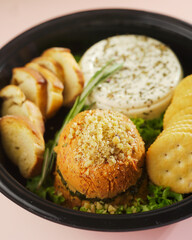 Artisanal Cheese Platter: A Delectable Assortment of Cheeses, Bread, and Crackers for Effortless Entertaining