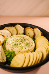 Savory Delights Platter: Tuna Pâté, Toasted Bread, and Gourmet Bites for the Ultimate Party Host
