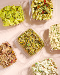 Fiesta Flavor Fusion Platter: A Medley of Ready-to-Serve Party Snack Trays with Olives, Chips, Pasta, Shredded Meat, Tuna, and Chipotle Chicken
