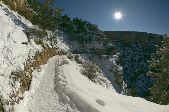Bright Angel Trail on the South Rim of Grand Canyon Arizona just past the first tunnel in winter under Moonlight.