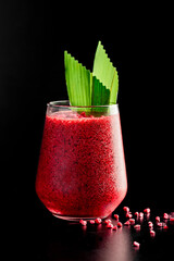 Fruit and vegetable smoothie on a black background