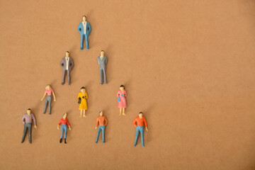 The concept of people forming a team in a pyramid shape reflects the idea of a hierarchical...