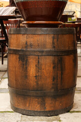 Fototapeta premium Traditional wooden barrel on street outdoors. Wine making