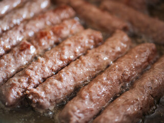 Sizzling Cevapcici - A Delectable Blend of Beef and Pork Pan-Fried to Perfection
