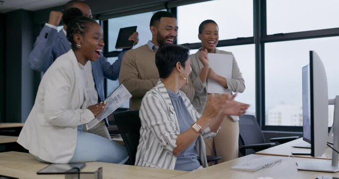 Applause, celebration and business people in the office by a computer for good news or teamwork success. Diversity, goals and group of corporate lawyers clapping hands by technology in the workplace.