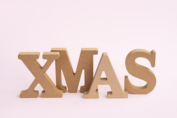 Wooden XMAS Word. Minimalist composition.