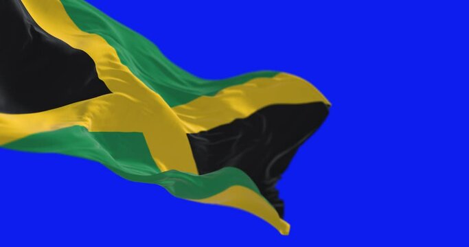 Jamaica national flag waving isolated on a blue background