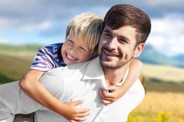 Happy young family hug on nature background