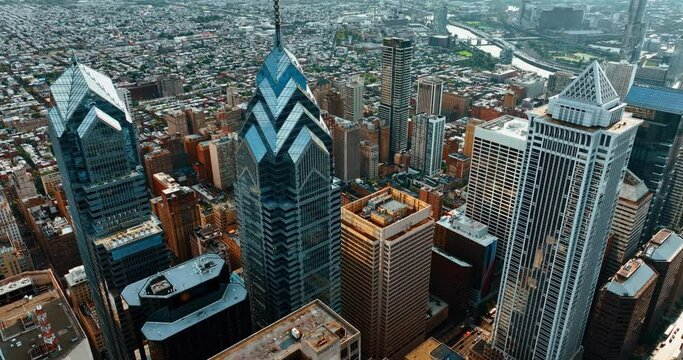 Skyscraper complex Liberty Place in Philadelphia. Drone footage rising above the cityscape at daytime.
