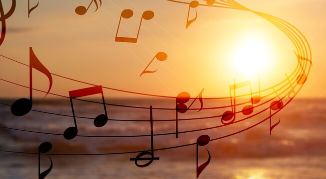 Beautiful musical notes on sunset sky background