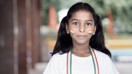 Portrait of Cute India Child or Kids celebrating Independence or Republic day of India