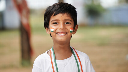 Portrait of Cute India Child or Kids celebrating Independence or Republic day of India