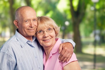 Happy senior couple have together in a garden