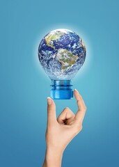 Globe planet in plastic bottle, recycling concept.